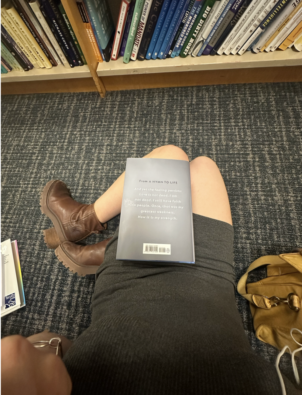sitting on a bookstore floor reading Gisèle Pelicot's book
